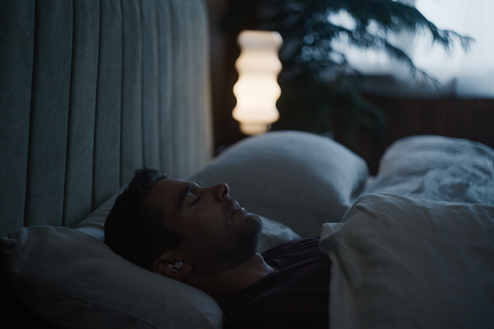 Man resting comfortably in bed 