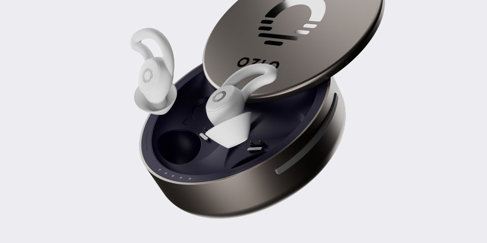 Close-up of Ozlo Sleepbuds in their sleek charging case, showcasing advanced design and ergonomic features.